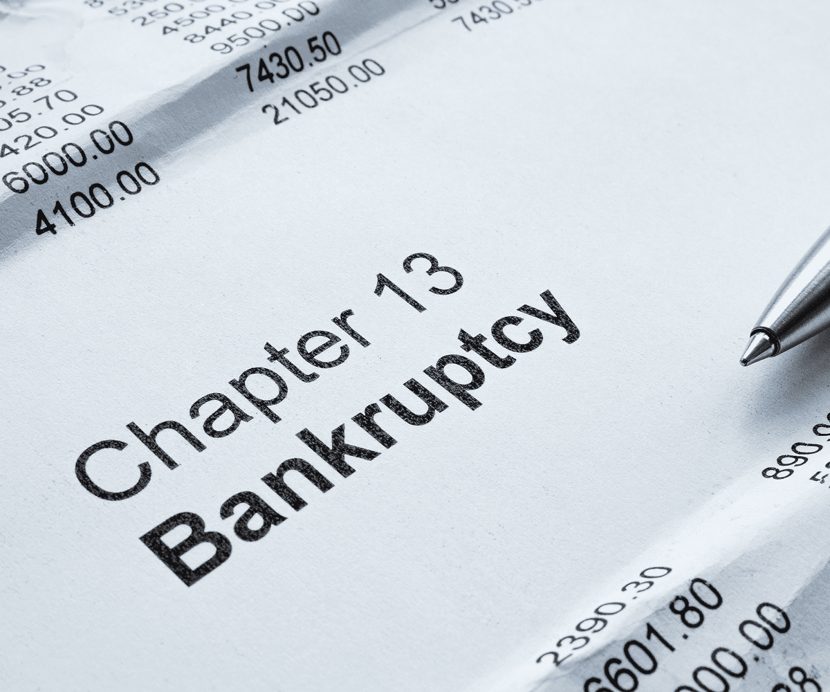 Chapter 13 bankruptcy document with pen.