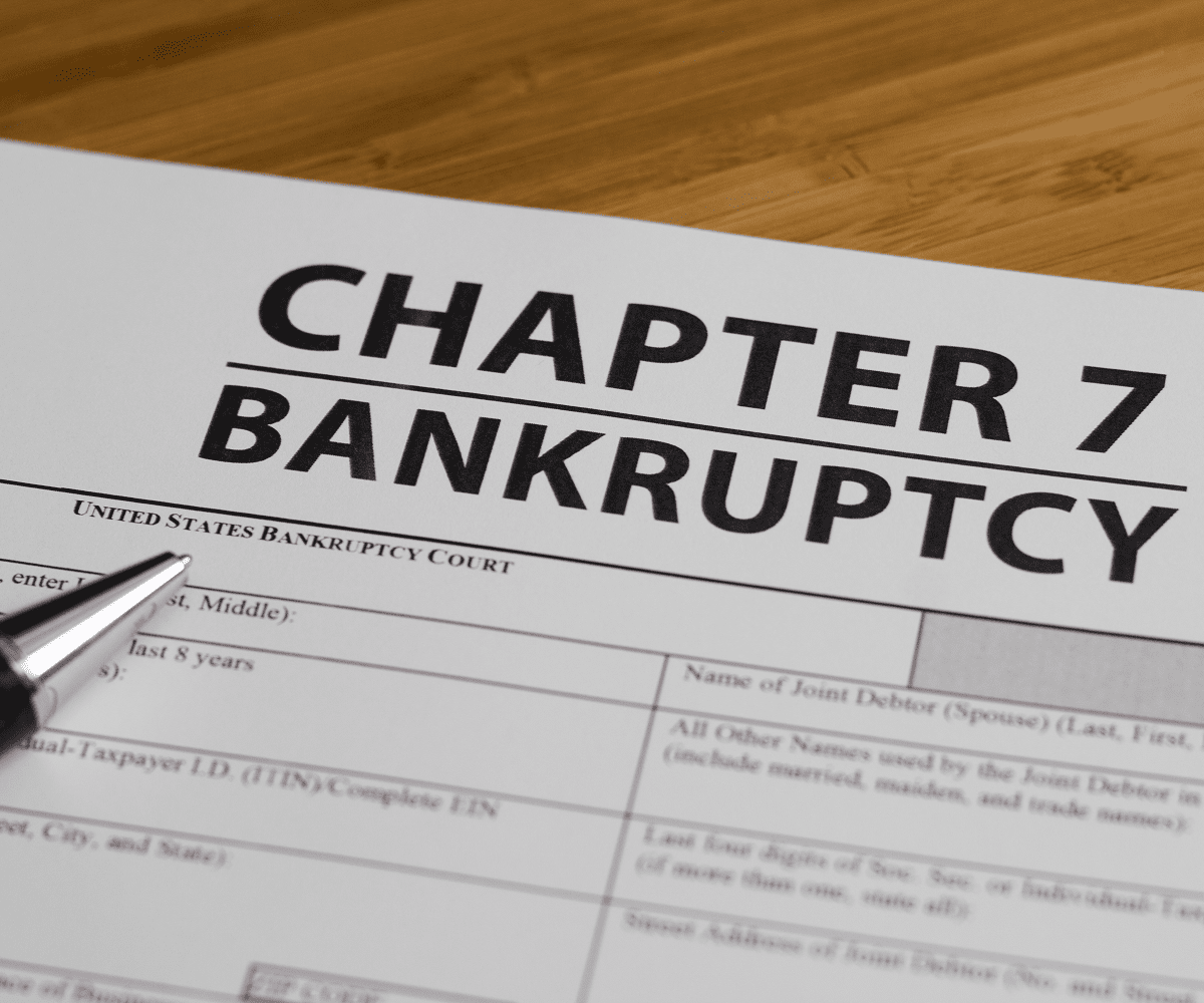 Chapter 7 bankruptcy form on table.