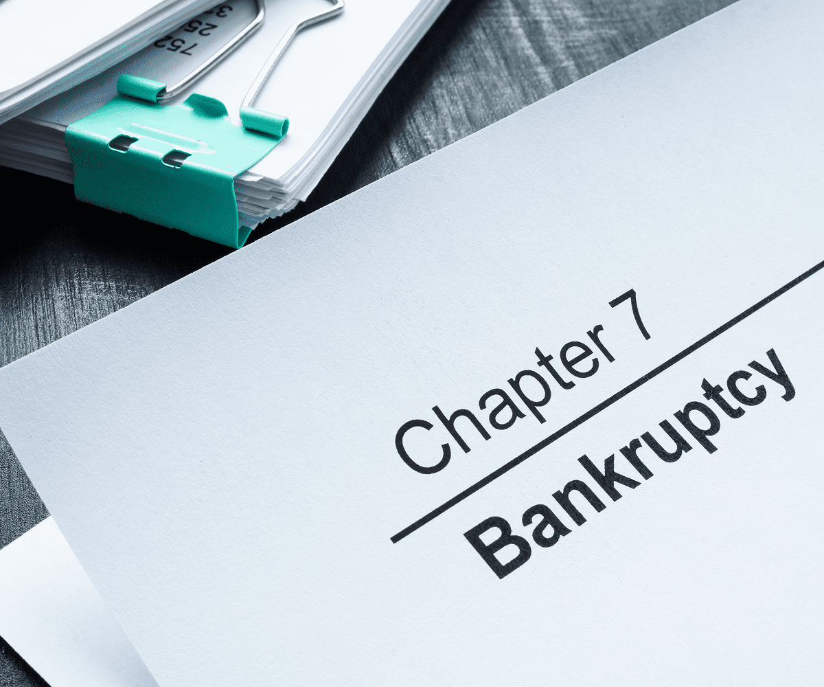 Chapter 7 bankruptcy document on desk.