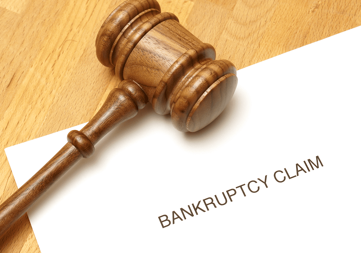 Gavel on bankruptcy claim document.
