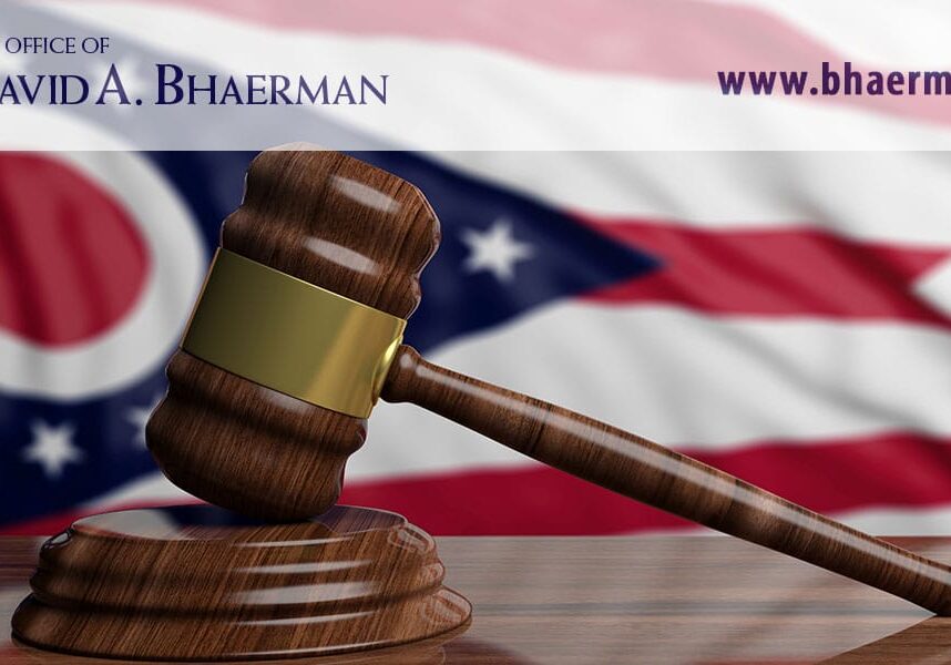 Gavel on table, Ohio flag background.