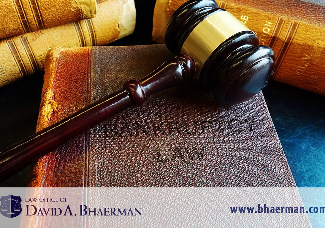 Gavel on bankruptcy law book.